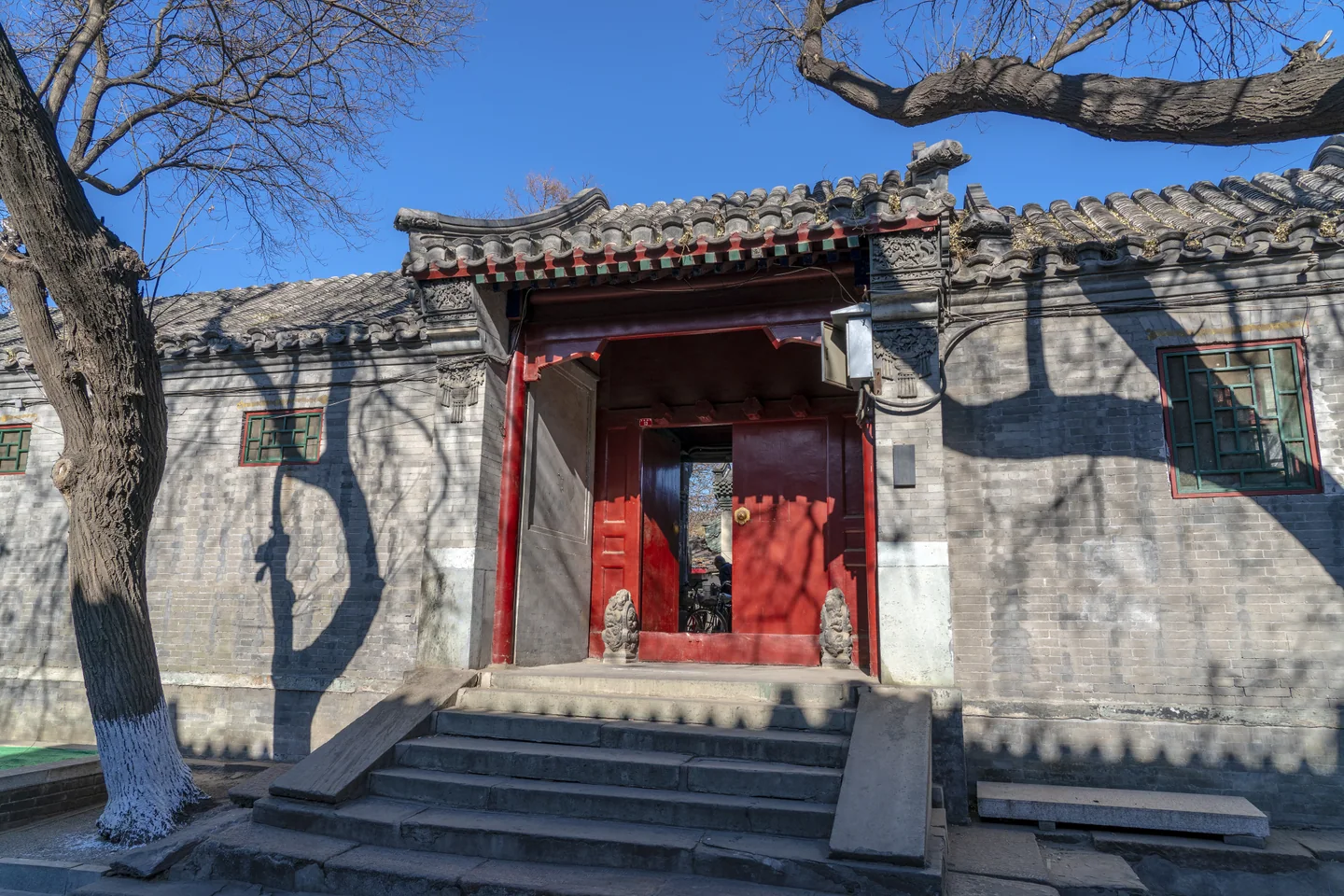 A stepped courtyard entrance in Beijing's Fangjia Hutong.