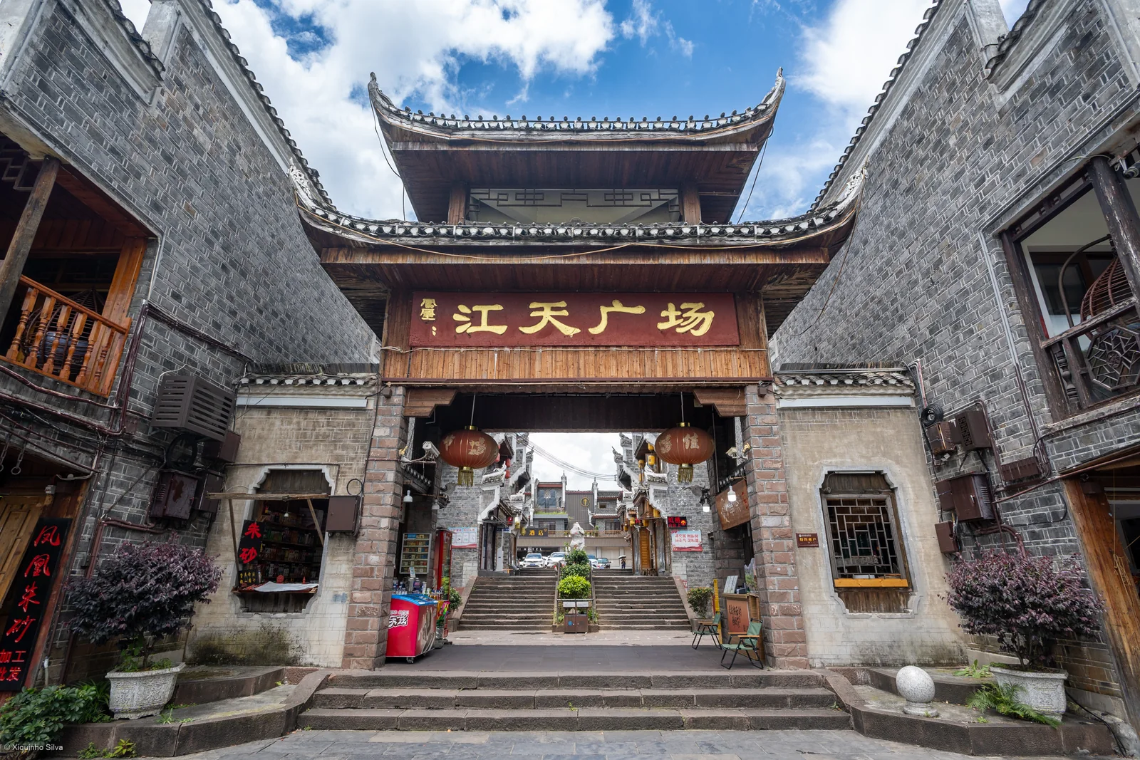 A modern commercial gateway marked Jiangtian Plaza in Fenghuang Ancient Town.
