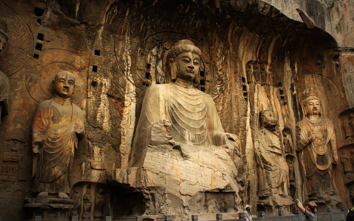 Historic Buddhist sculptures carved into the rock at the Longmen Grottoes in Luoyang.