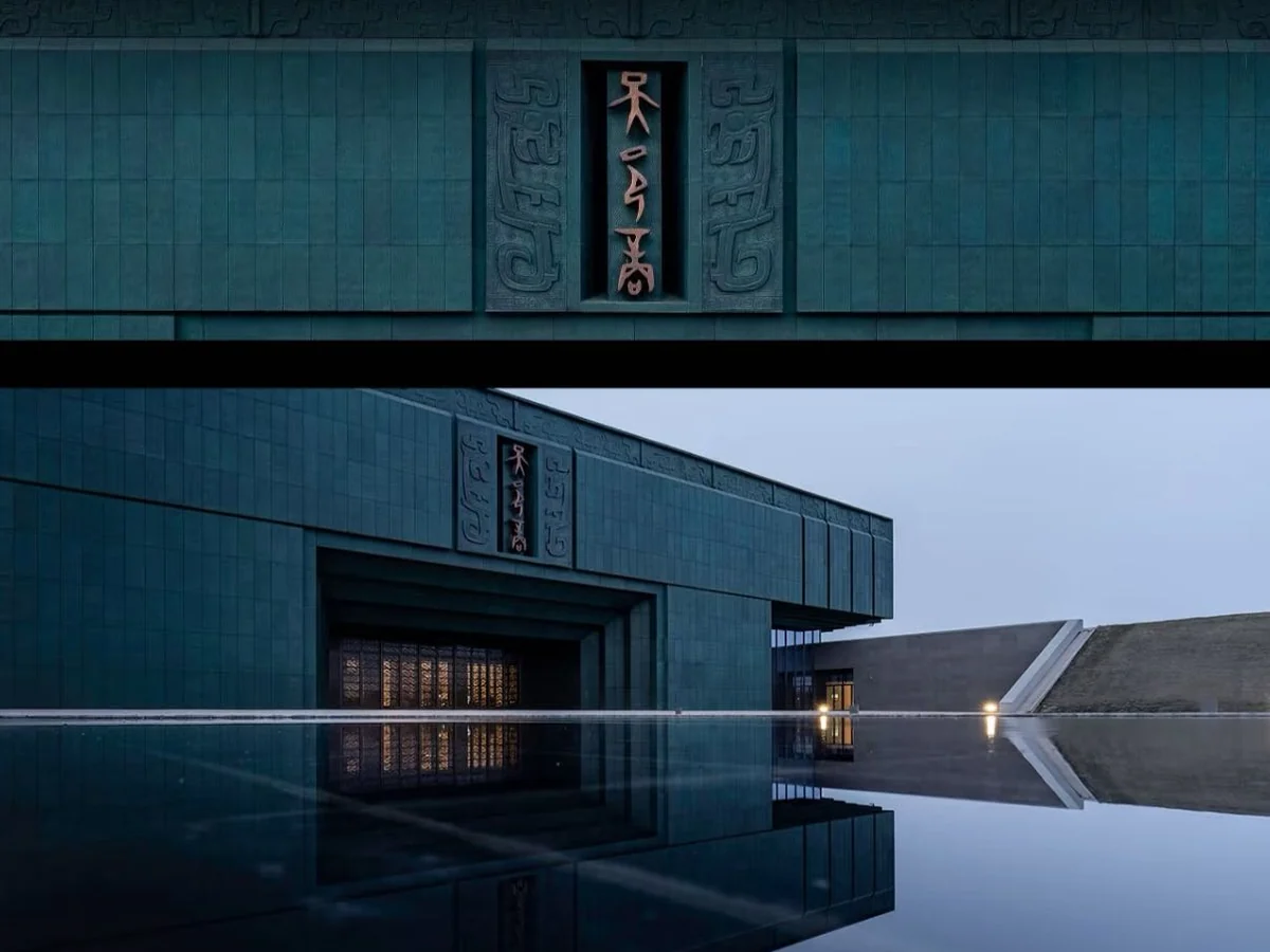 Modern dark-green facade and reflecting pool of Yin Xu Museum