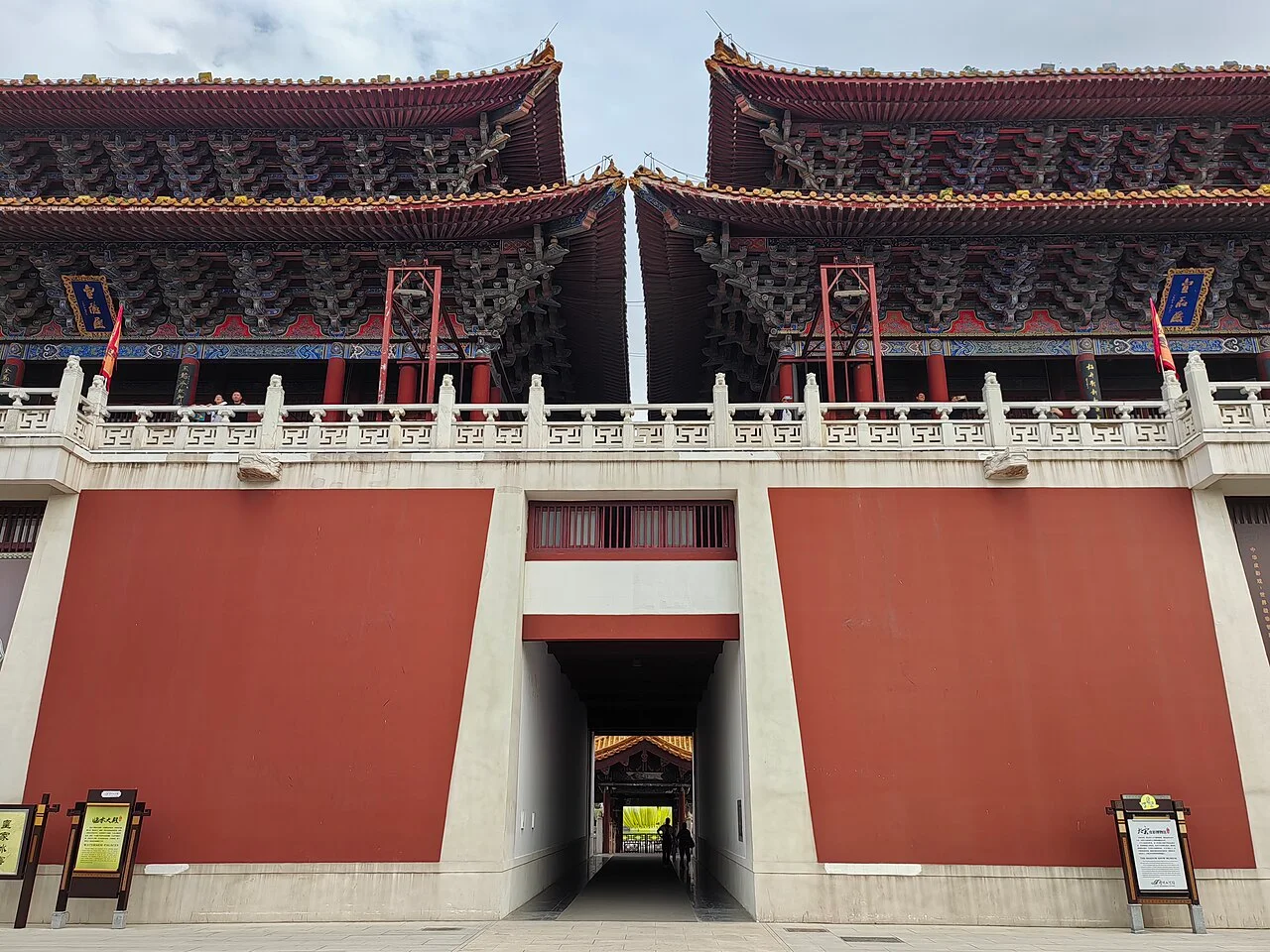 The façade and paired halls of the modern Linshui Hall complex inside Qingming Riverside Landscape Garden.