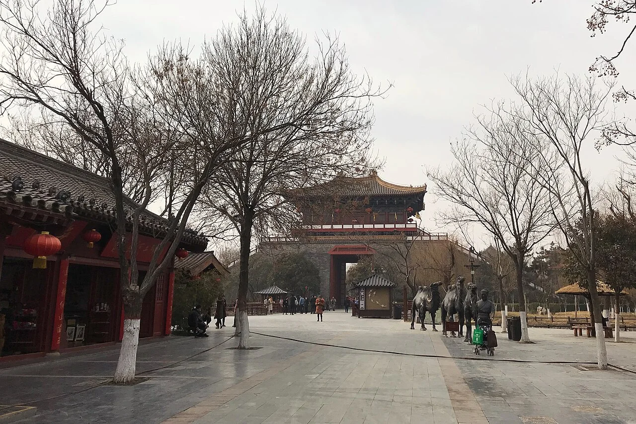 The modern Shangshan Gate and visitor route inside Qingming Riverside Landscape Garden.