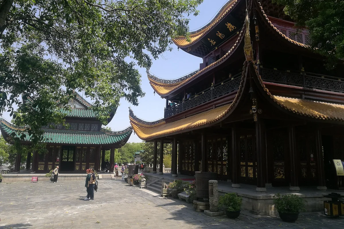 A side view of Yueyang Tower showing its timber frame and helmet-shaped roof