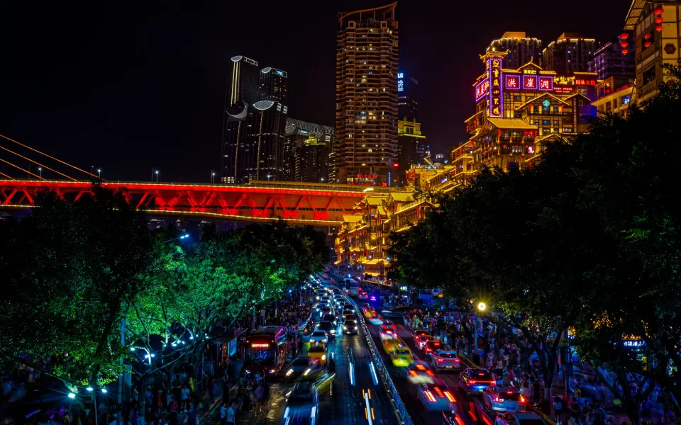 Hongya Cave and Qiansimen Bridge illuminated beside the Jialing River