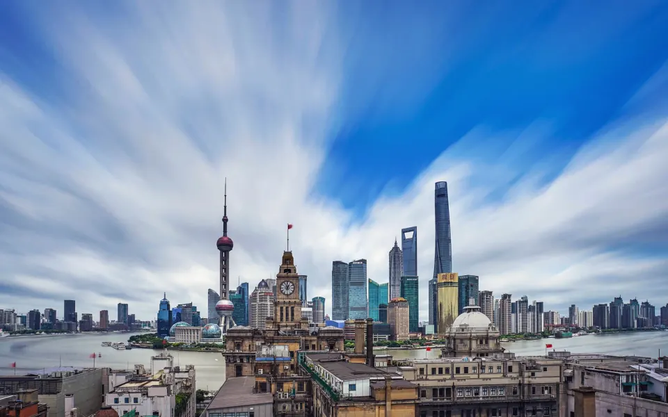 The Bund clock tower and the Lujiazui skyline at dusk