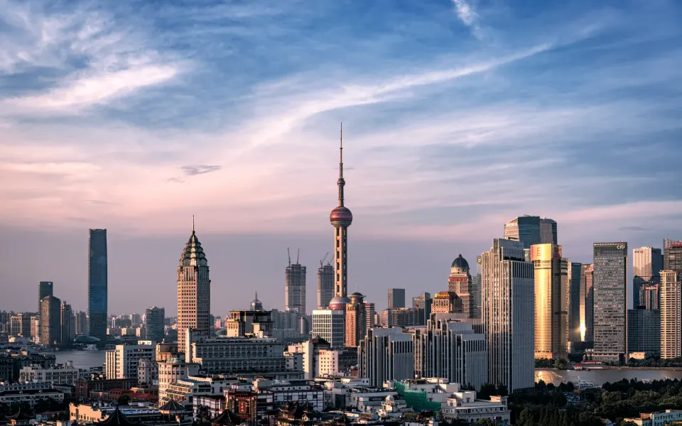 Shanghai's historic rooftops and the Lujiazui skyline across the Huangpu River
