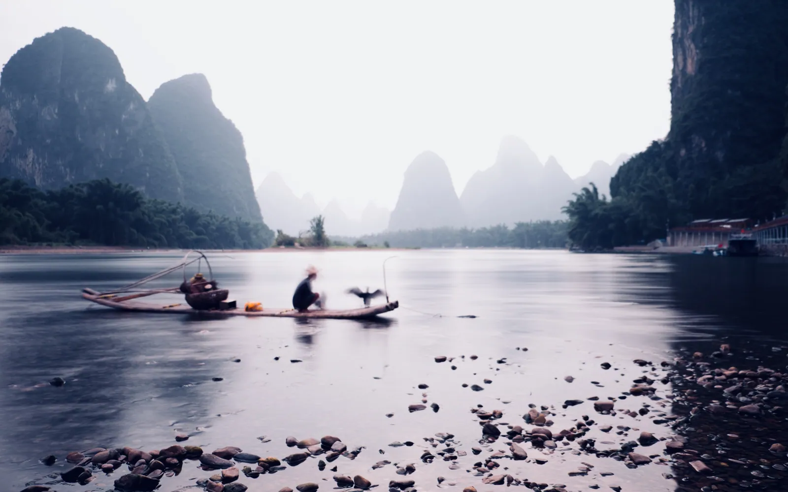 A fisherman on a bamboo raft on the Li River