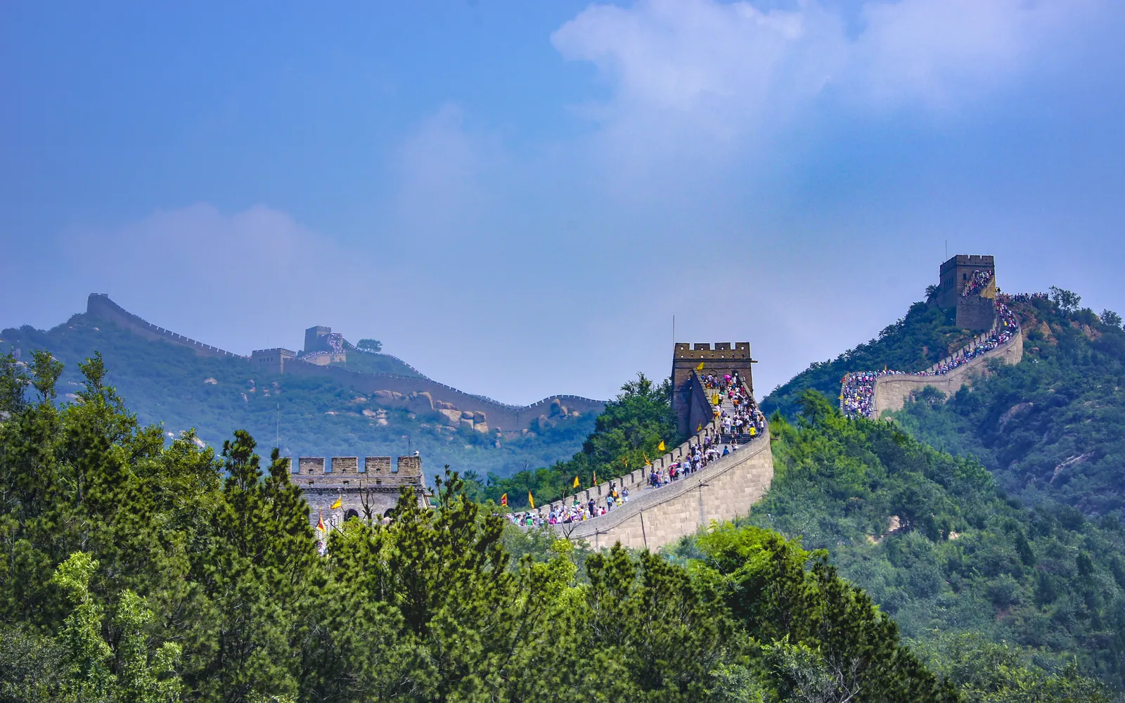 Great Wall climbing a forested ridge