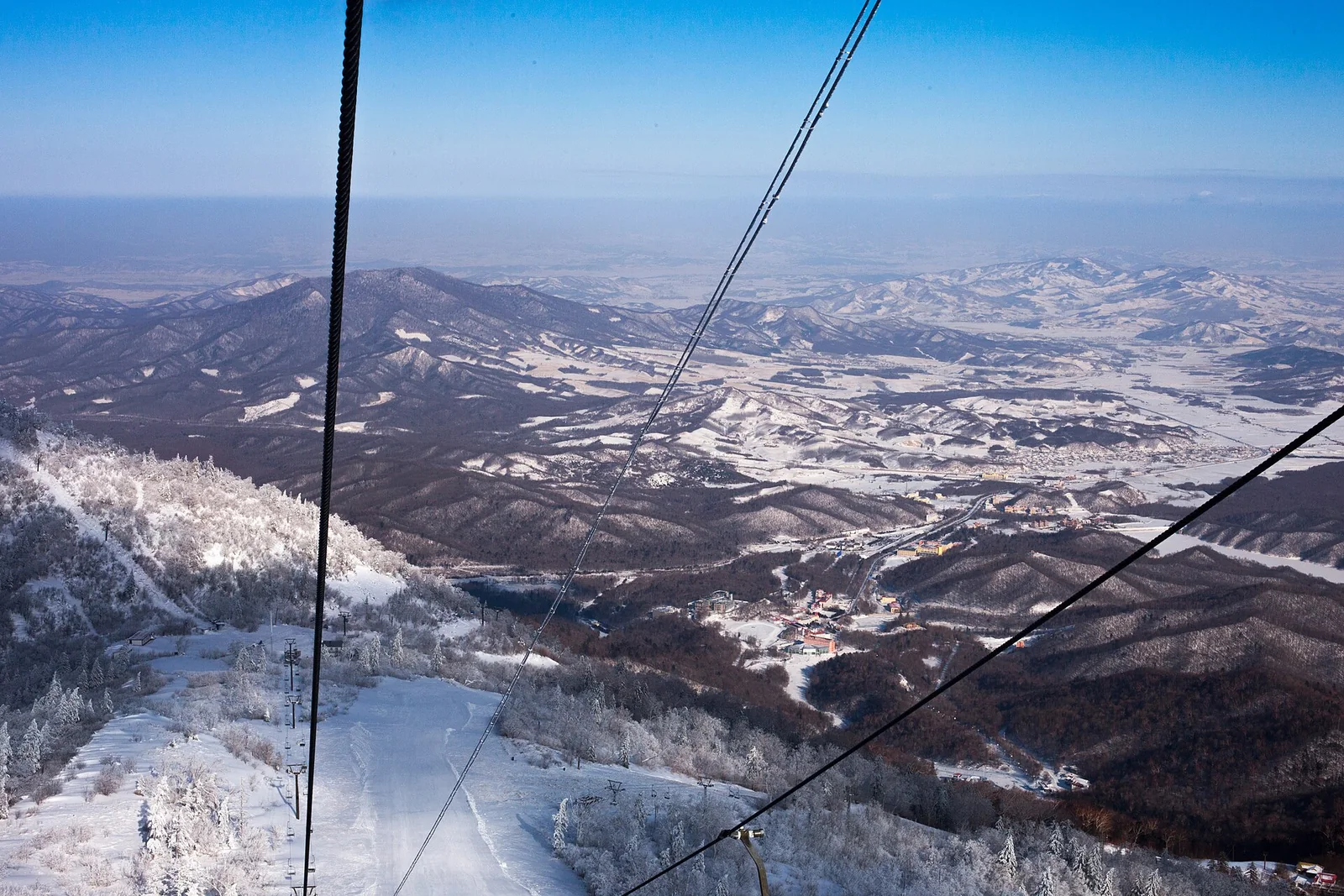 Snowy Yabuli ski hills seen from a chairlift