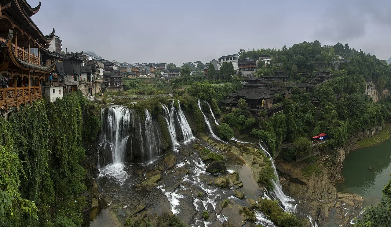 Furong Town buildings and waterfall beside the river in western Hunan