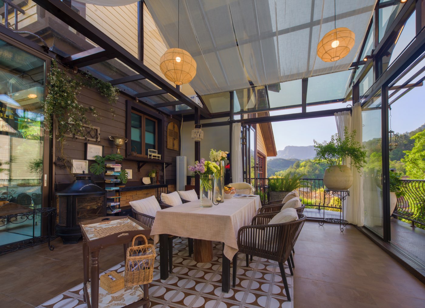 Glass-enclosed dining area with trees and distant mountains in the signature-stay candidate set